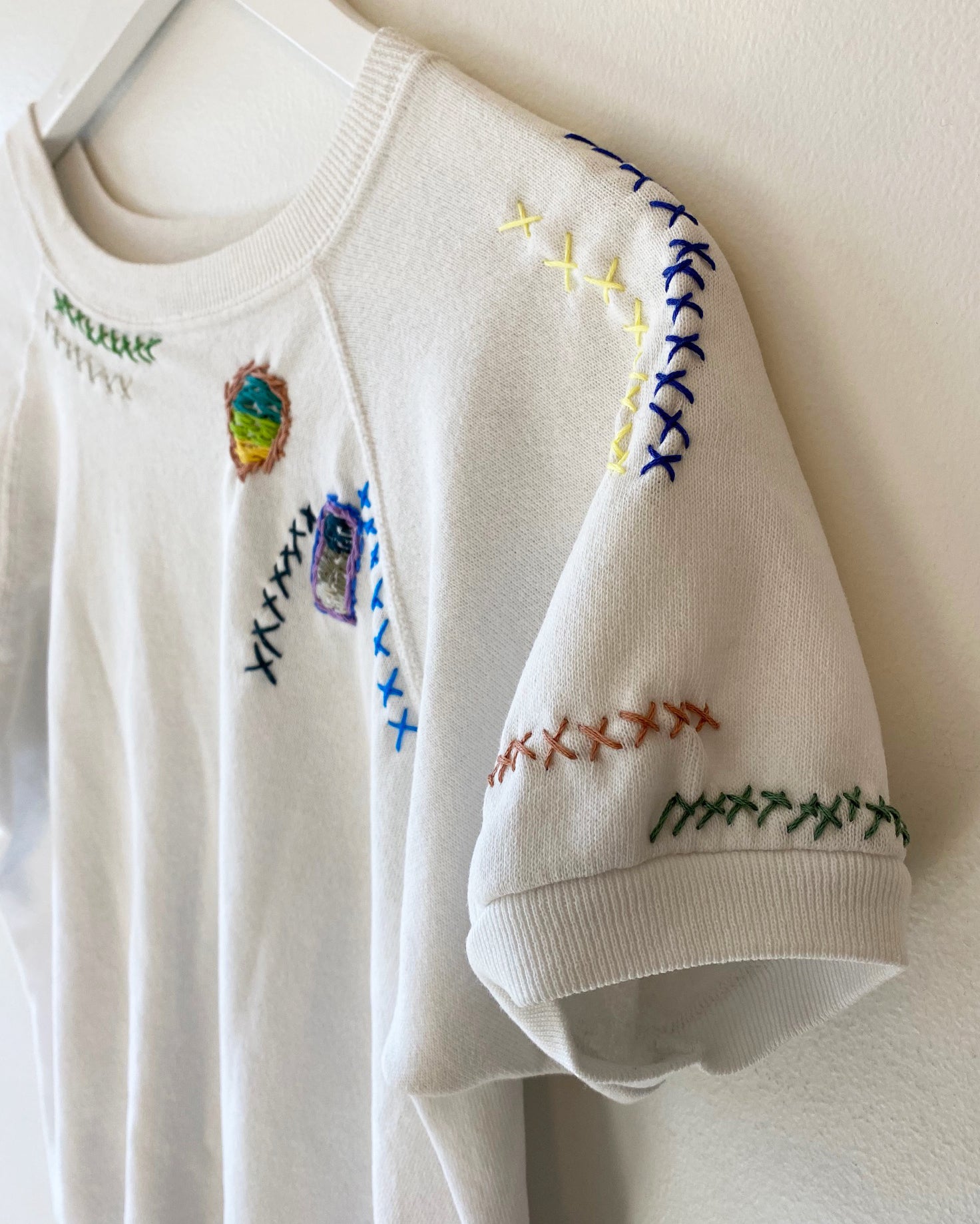 Aged white cotton sweatshirt with embroidery